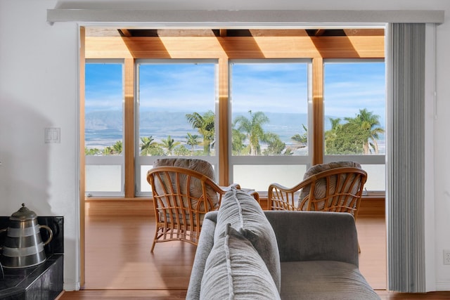 sunroom / solarium with a mountain view