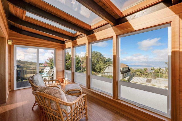 sunroom / solarium with vaulted ceiling with beams and wood ceiling