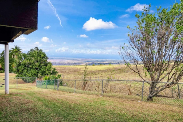 view of yard with a rural view