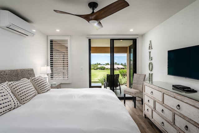 bedroom with access to outside, ceiling fan, a wall unit AC, and dark wood-type flooring