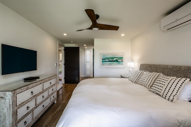 bedroom with a wall mounted air conditioner, dark hardwood / wood-style floors, and ceiling fan