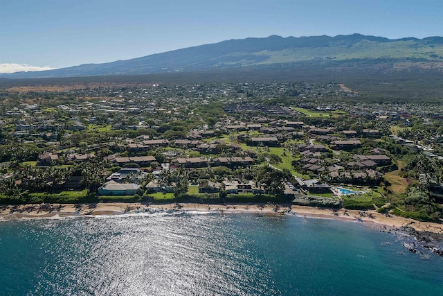 aerial view featuring a water and mountain view