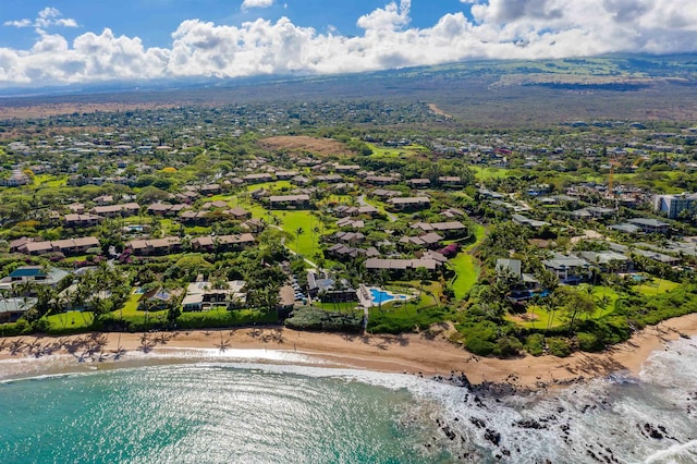 bird's eye view with a water view and a beach view