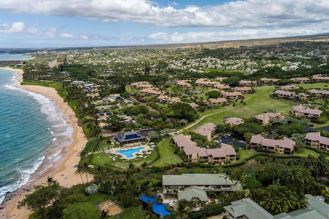 drone / aerial view with a beach view and a water view