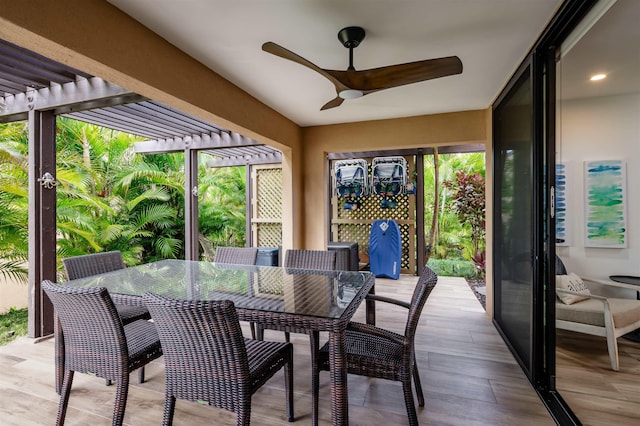 sunroom with ceiling fan and plenty of natural light