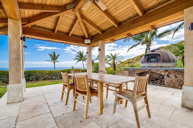 view of patio / terrace featuring a gazebo and exterior fireplace