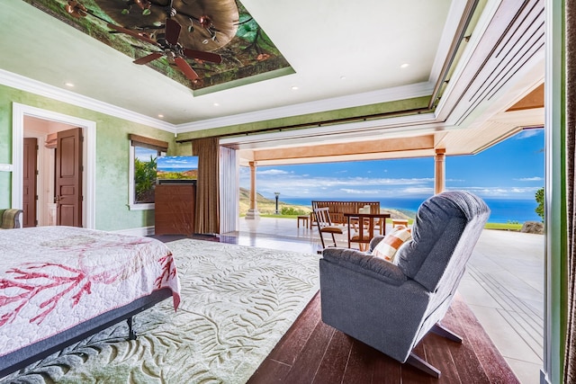 bedroom featuring a raised ceiling and ornamental molding