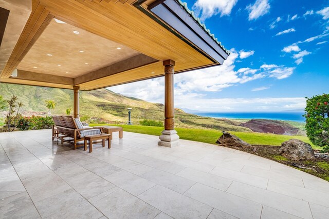 view of patio / terrace with a water view