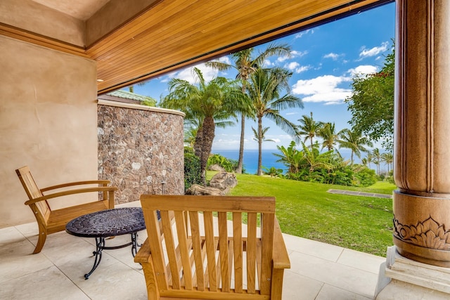 view of patio featuring a water view