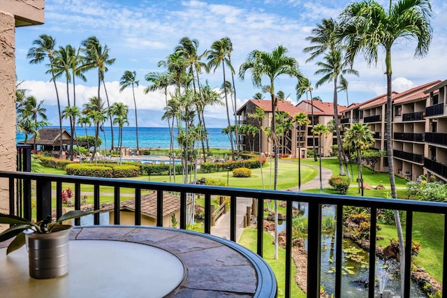 balcony featuring a water view