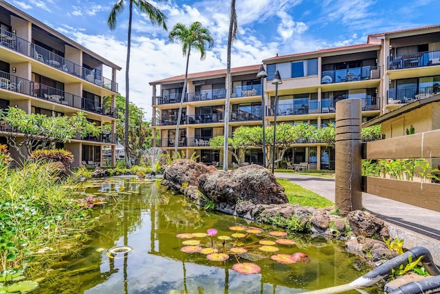 surrounding community with a garden pond