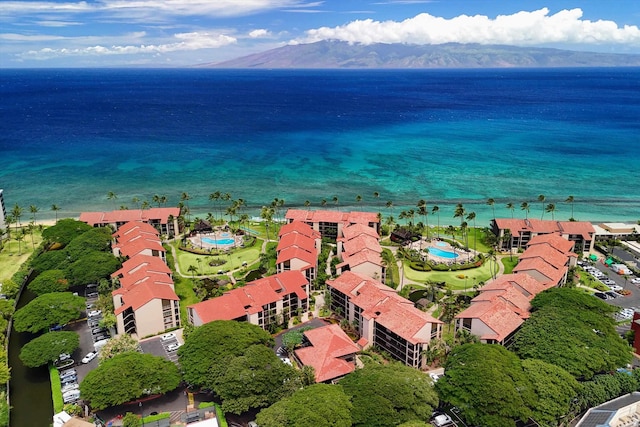 drone / aerial view with a water and mountain view