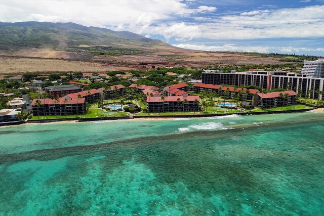 bird's eye view featuring a beach view and a water and mountain view