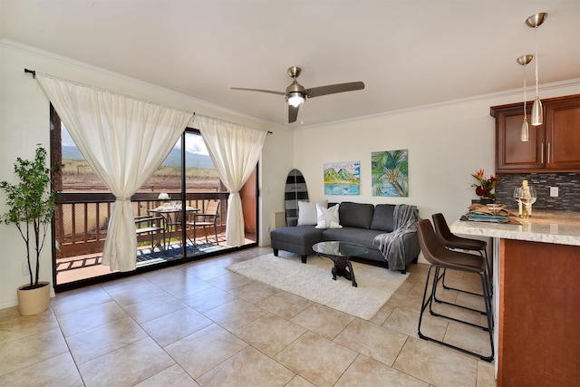 tiled living room with ceiling fan and ornamental molding