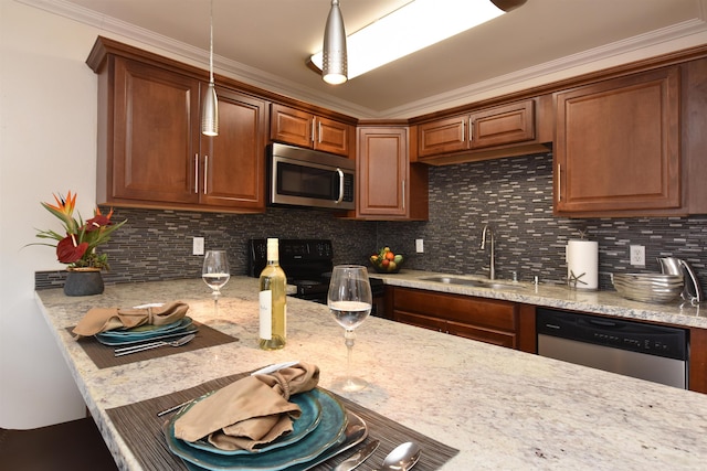 kitchen featuring backsplash, sink, and appliances with stainless steel finishes