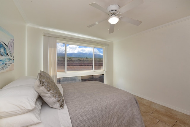 tiled bedroom with ceiling fan and crown molding