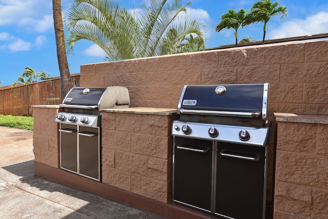 view of patio / terrace featuring area for grilling and a grill