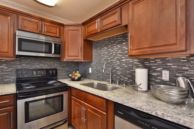 kitchen with crown molding, sink, stainless steel appliances, and decorative backsplash