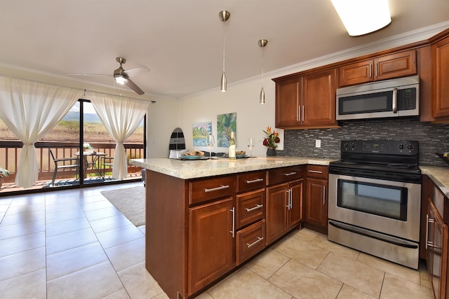 kitchen featuring ceiling fan, stainless steel appliances, kitchen peninsula, and ornamental molding