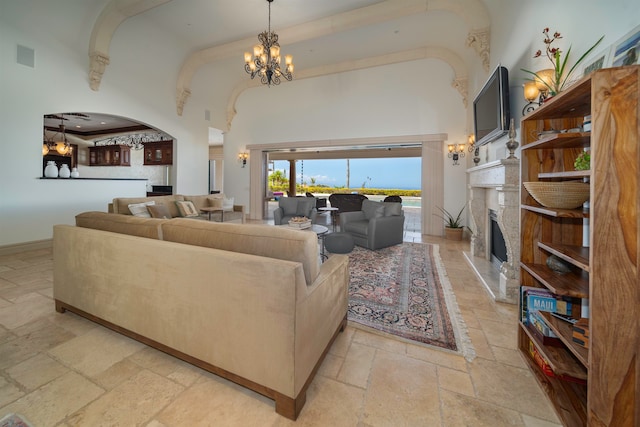 living room with a high ceiling and a notable chandelier