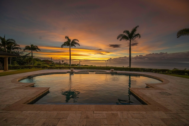 view of pool at dusk