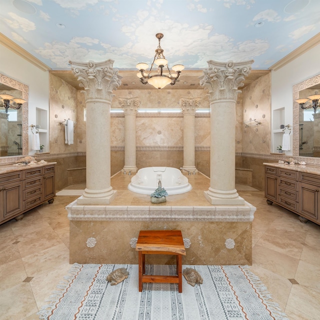 bathroom with tiled tub, ornamental molding, a notable chandelier, and vanity