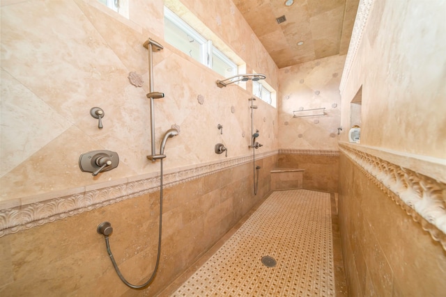 bathroom with a tile shower