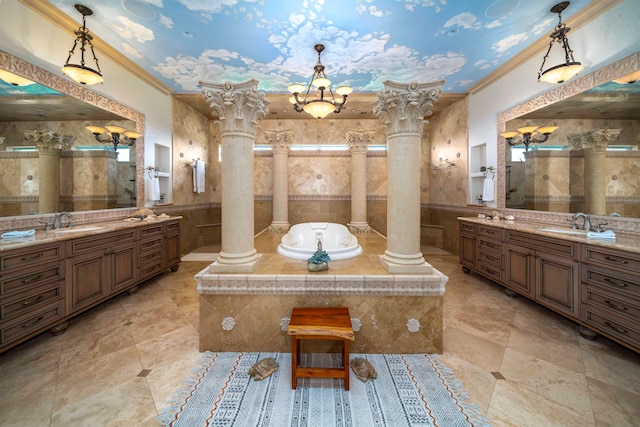 bathroom featuring ornamental molding, shower with separate bathtub, decorative columns, and vanity