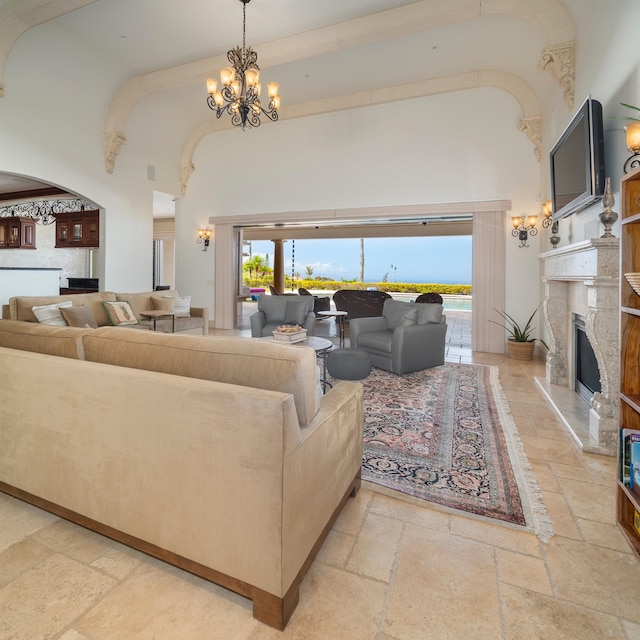 living room featuring a chandelier and a high ceiling