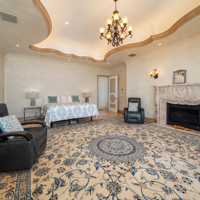 bedroom with a high end fireplace and a chandelier