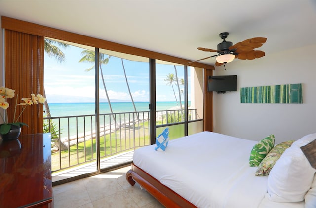 bedroom featuring a water view, ceiling fan, light tile patterned floors, and access to outside