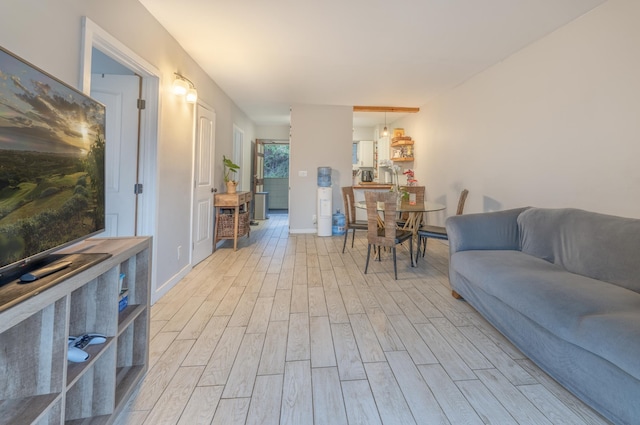 1063 Lower Main St Unit 315, Wailuku, HI 96793 - living room with light wood-style floors and baseboards