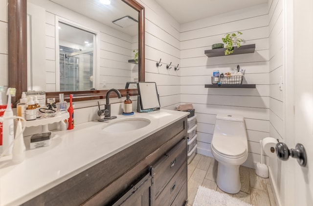1063 Lower Main St Unit 315, Wailuku, HI 96793 - full bathroom featuring toilet, vanity, a shower stall, and wooden walls