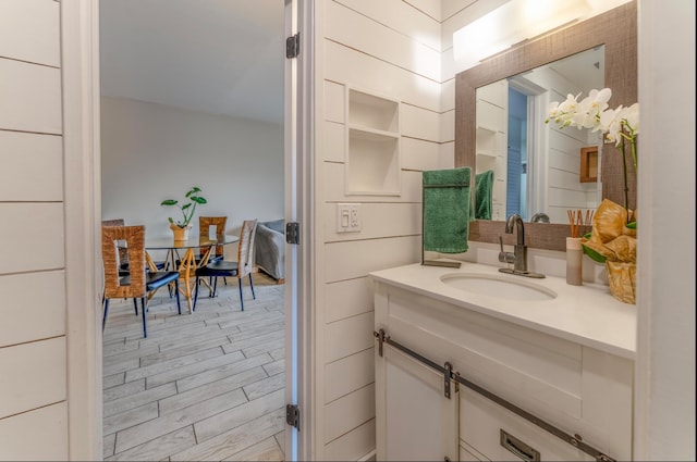 bathroom with vanity and hardwood / wood-style flooring