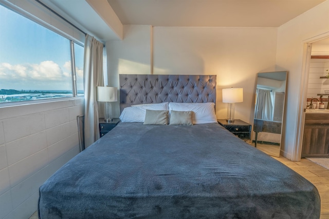 bedroom featuring a water view