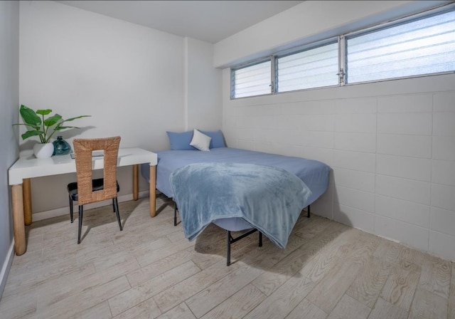 bedroom with light wood-type flooring