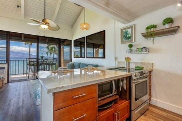 kitchen featuring wooden ceiling, light stone counters, appliances with stainless steel finishes, light wood-type flooring, and lofted ceiling with beams