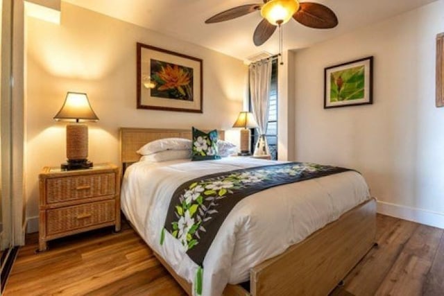 bedroom featuring hardwood / wood-style floors and ceiling fan