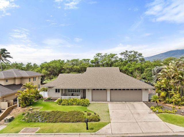 61 Huluhulu Pl, Kahului, HI 96732 - view of front facade featuring an attached garage, stucco siding, concrete driveway, and covered porch