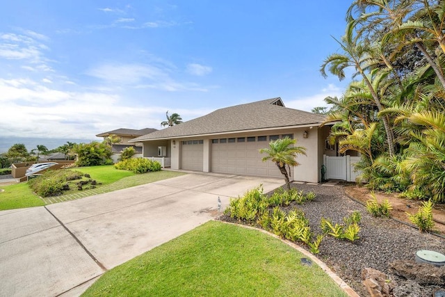 61 Huluhulu Pl, Kahului, HI 96732 - ranch-style house featuring a garage, stucco siding, concrete driveway, and a shingled roof