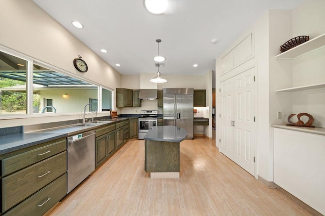 61 Huluhulu Pl, Kahului, HI 96732 - kitchen featuring appliances with stainless steel finishes, a sink, dark countertops, light wood-style floors, and a center island