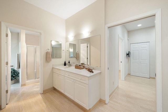 61 Huluhulu Pl, Kahului, HI 96732 - full bath featuring wood finished floors, vanity, a stall shower, and baseboards