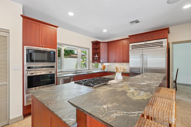 70 Pukolu Way, Kihei, HI 96753 - kitchen with built in appliances, a kitchen island, open shelves, recessed lighting, and a sink