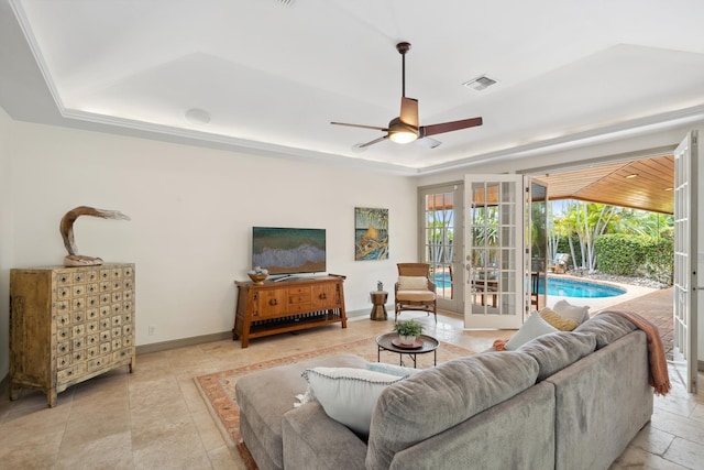 70 Pukolu Way, Kihei, HI 96753 - living area with a tray ceiling, a ceiling fan, french doors, and baseboards