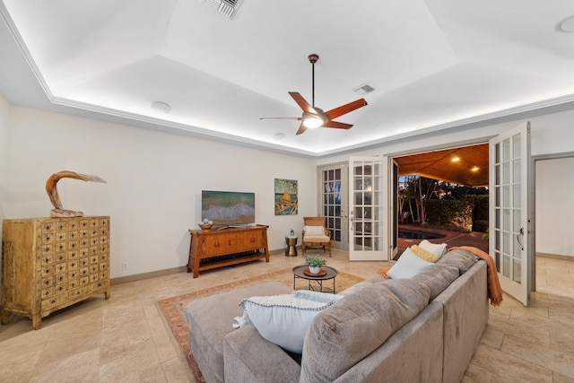 70 Pukolu Way, Kihei, HI 96753 - living area featuring a tray ceiling, french doors, ceiling fan, and baseboards