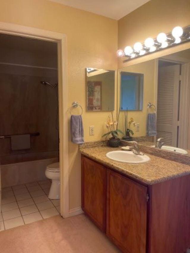 full bathroom with shower / washtub combination, toilet, tile patterned floors, and vanity