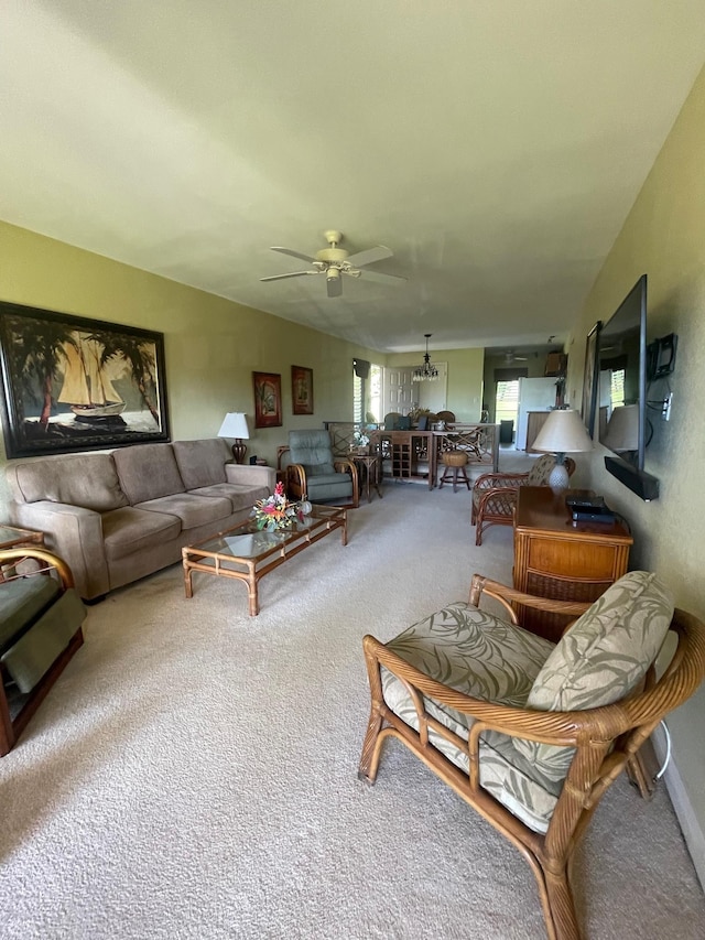 carpeted living room featuring ceiling fan