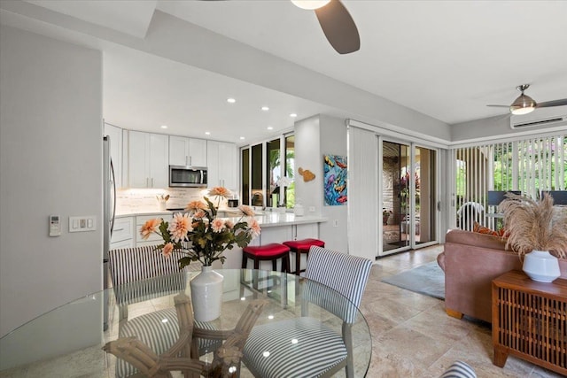 3150 Wailea Alanui Dr Unit 3007, Kihei, HI 96753 - dining room featuring ceiling fan, an AC wall unit, and recessed lighting