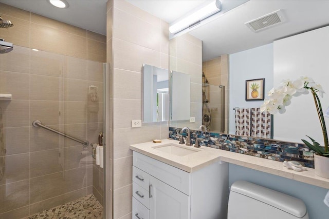3150 Wailea Alanui Dr Unit 3007, Kihei, HI 96753 - full bathroom featuring a stall shower, vanity, tasteful backsplash, and tile walls