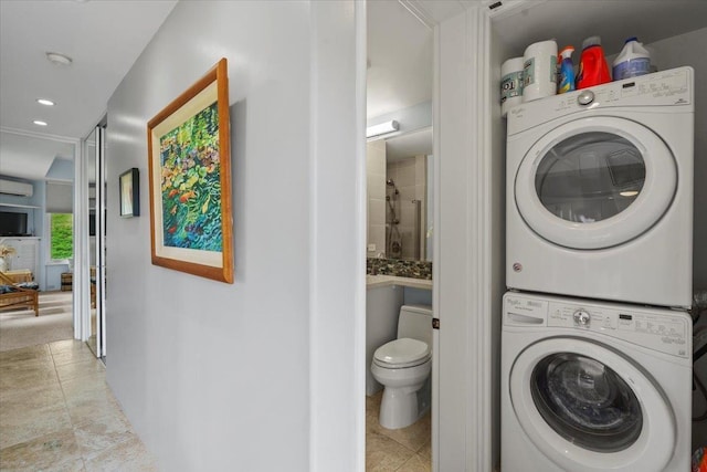 3150 Wailea Alanui Dr Unit 3007, Kihei, HI 96753 - washroom with stacked washing machine and dryer, a wall unit AC, recessed lighting, and light tile patterned flooring